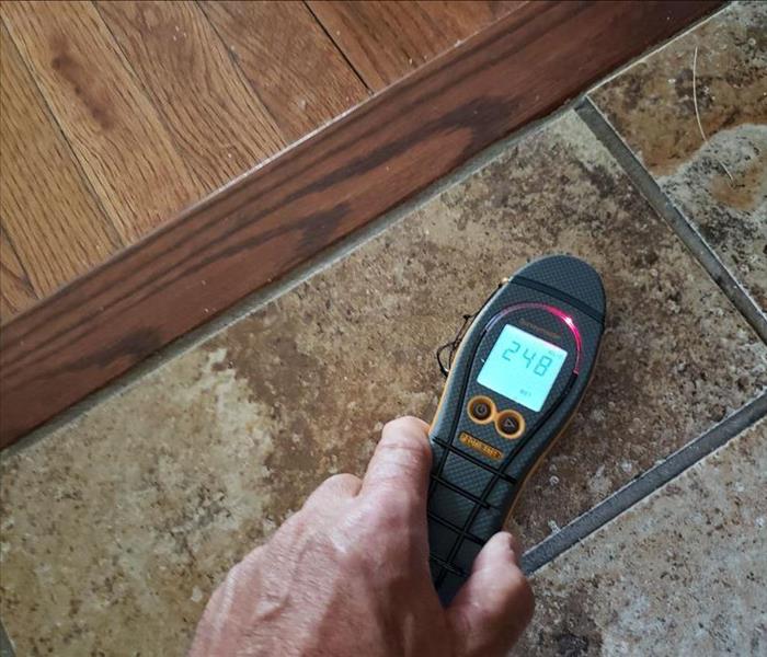SERVPRO moisture detection equipment on a tile floor