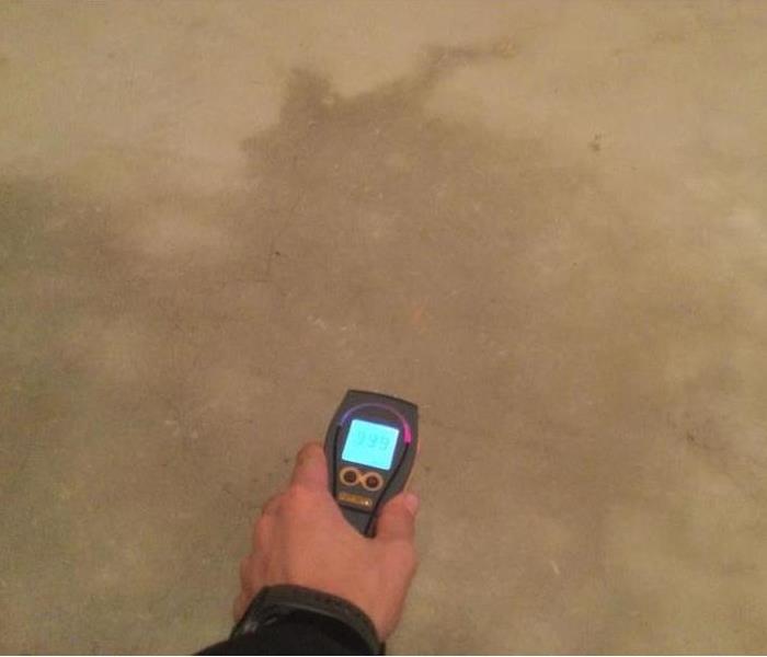 SERVPRO moisture detection equipment in front of wet sheetrock